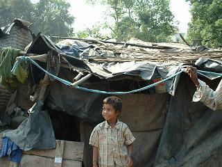 Mangal in front of their shack in Bilji Nagar